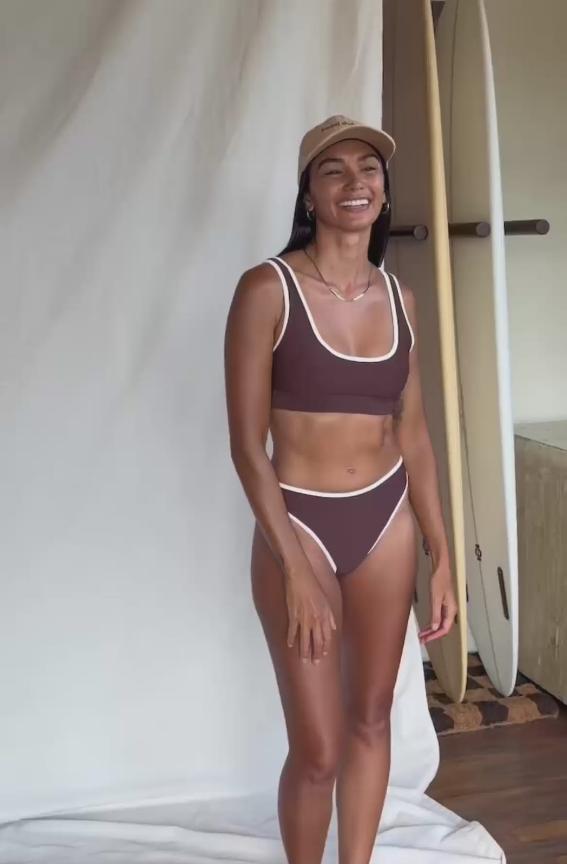 Load video: woman wearing brown bikini top and bottom