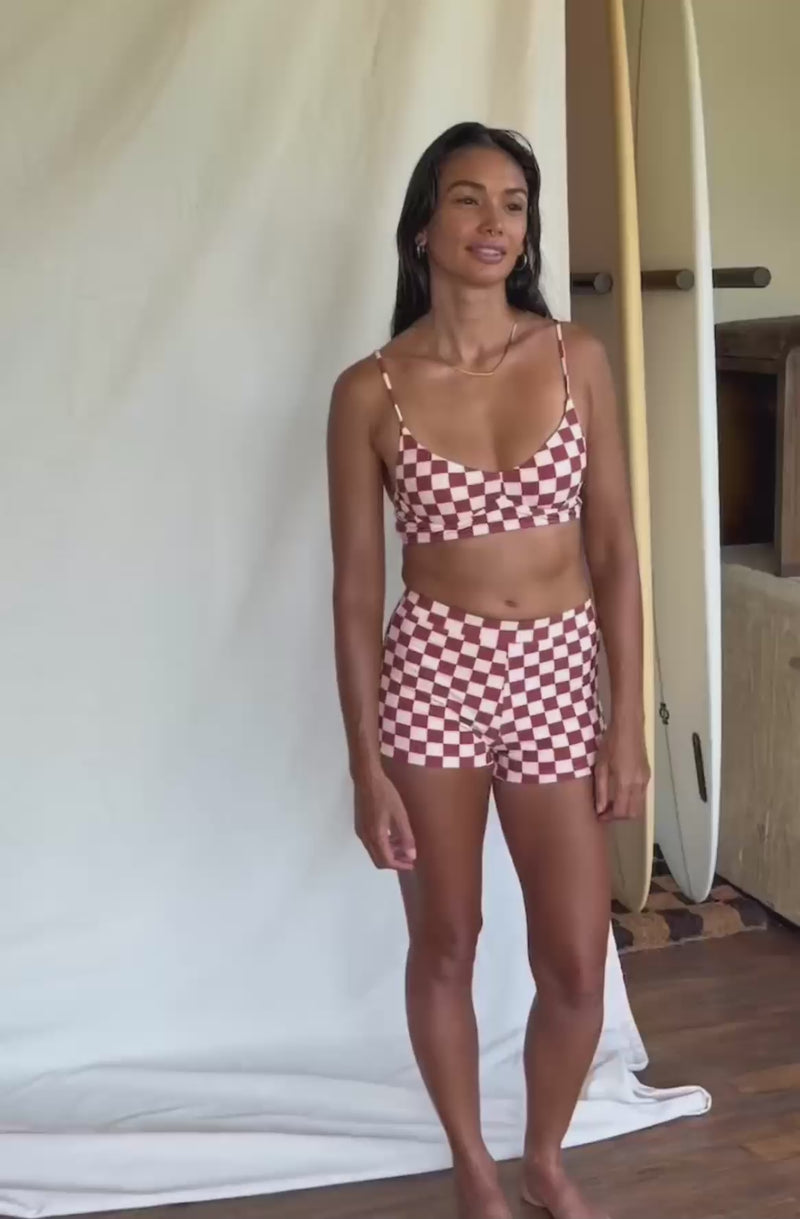 woman wearing check surf bikini
