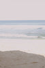 Woman standing in front of ocean wearing Surf_Bikini_Top_Kiyo_Sea_Foam_Camo