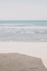 Woman standing in front of ocean wearing Surf_Bikini_Bottom_Lucky_Plum