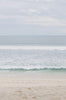 Woman standing in front of ocean wearing Surf_Leggings_Limitless_Tights_Slate_Gray