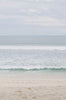 Woman standing in front of ocean wearing Surf_Bikini_Top_Lori_Burnt_Sienna 
