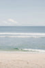 Woman standing in front of ocean wearing Surf_Bikini_Top_Jane_Sky_Glacier