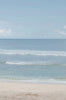 Woman standing in front of ocean wearing Surf_One_Piece_Paris_Morning_Glory